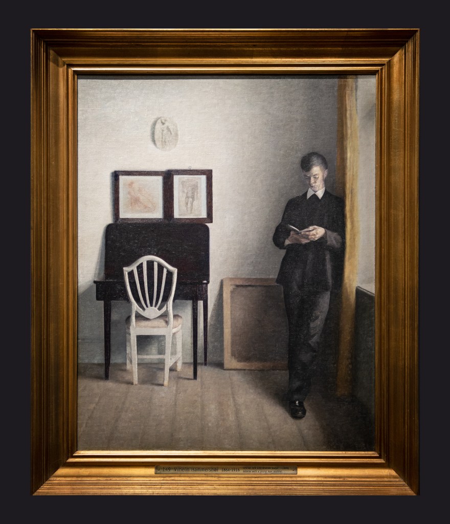 10 1898 Interior With A Young Man Reading by Leslie Hossack