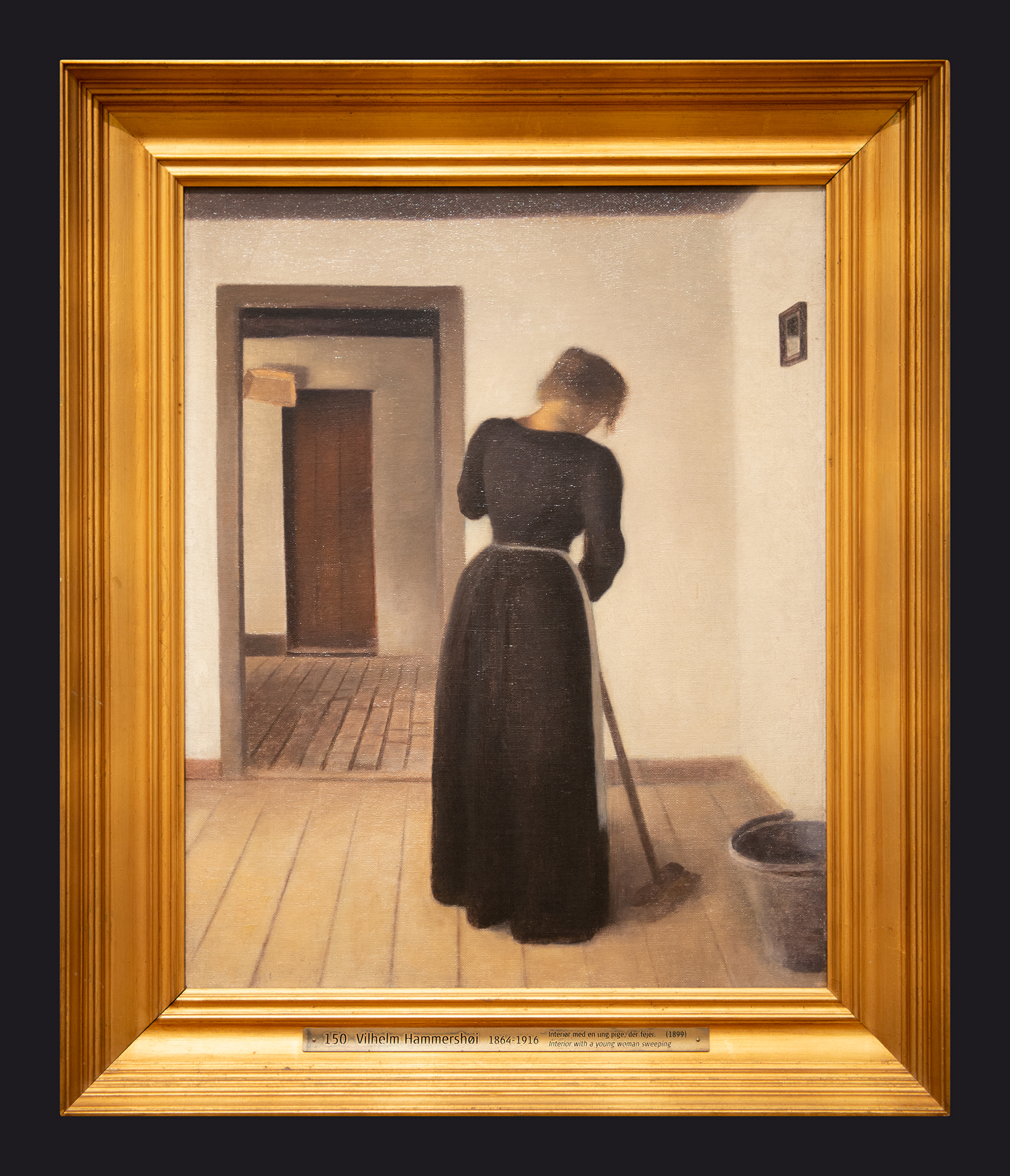 73 1899 Interior with a Young Woman Sweeping by Leslie Hossack